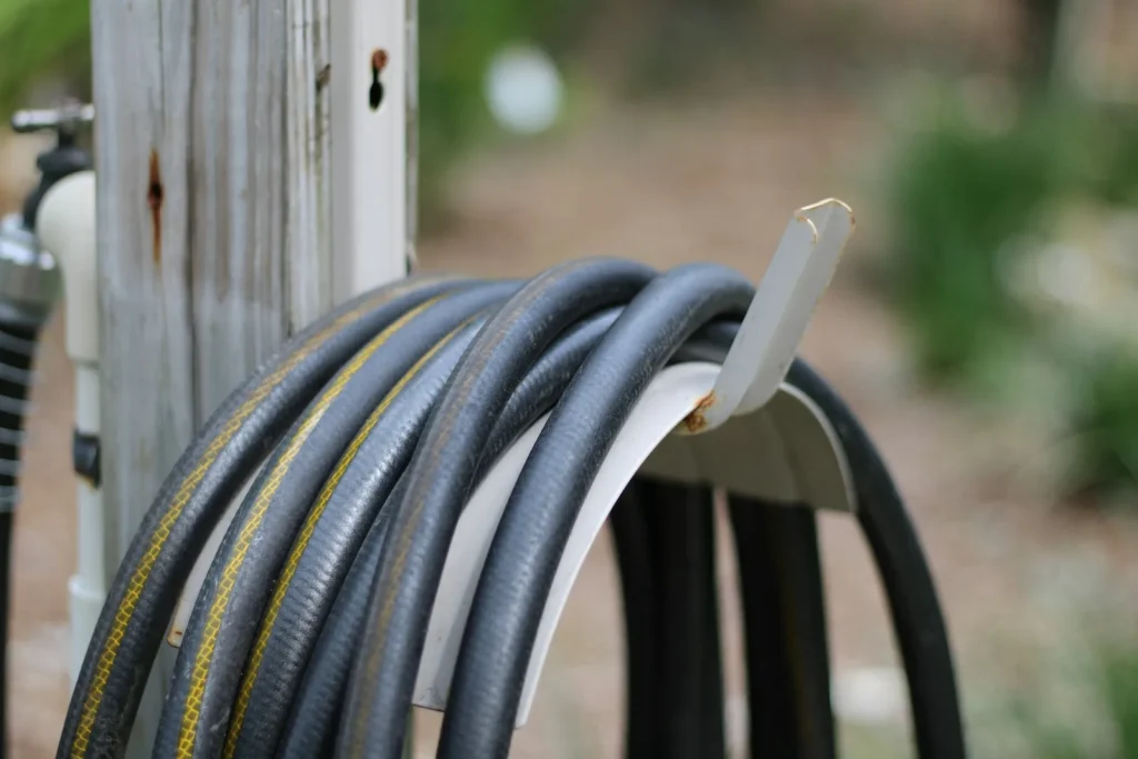 Floating robot cable hung in loose figure loops on a poolside caddy