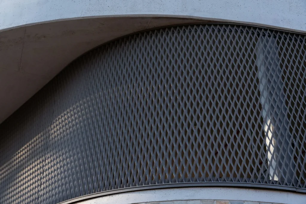 Underside of a pool robot showing an open intake grille and blades