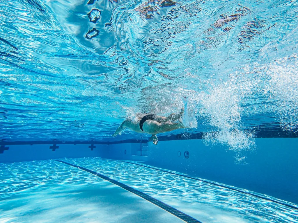 Sloped pool floor transitioning from shallow to deep water