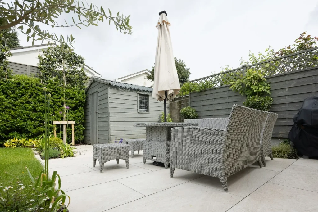 Shaded covered patio corner with pool gear stored neatly on shelves